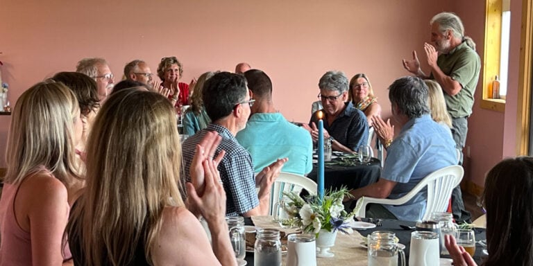 People enjoying farm-to-table dinner