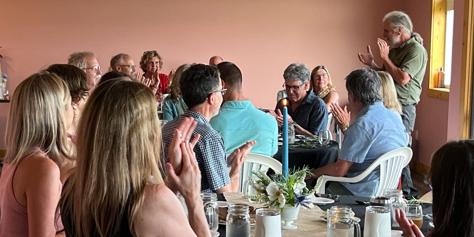People enjoying farm-to-table dinner