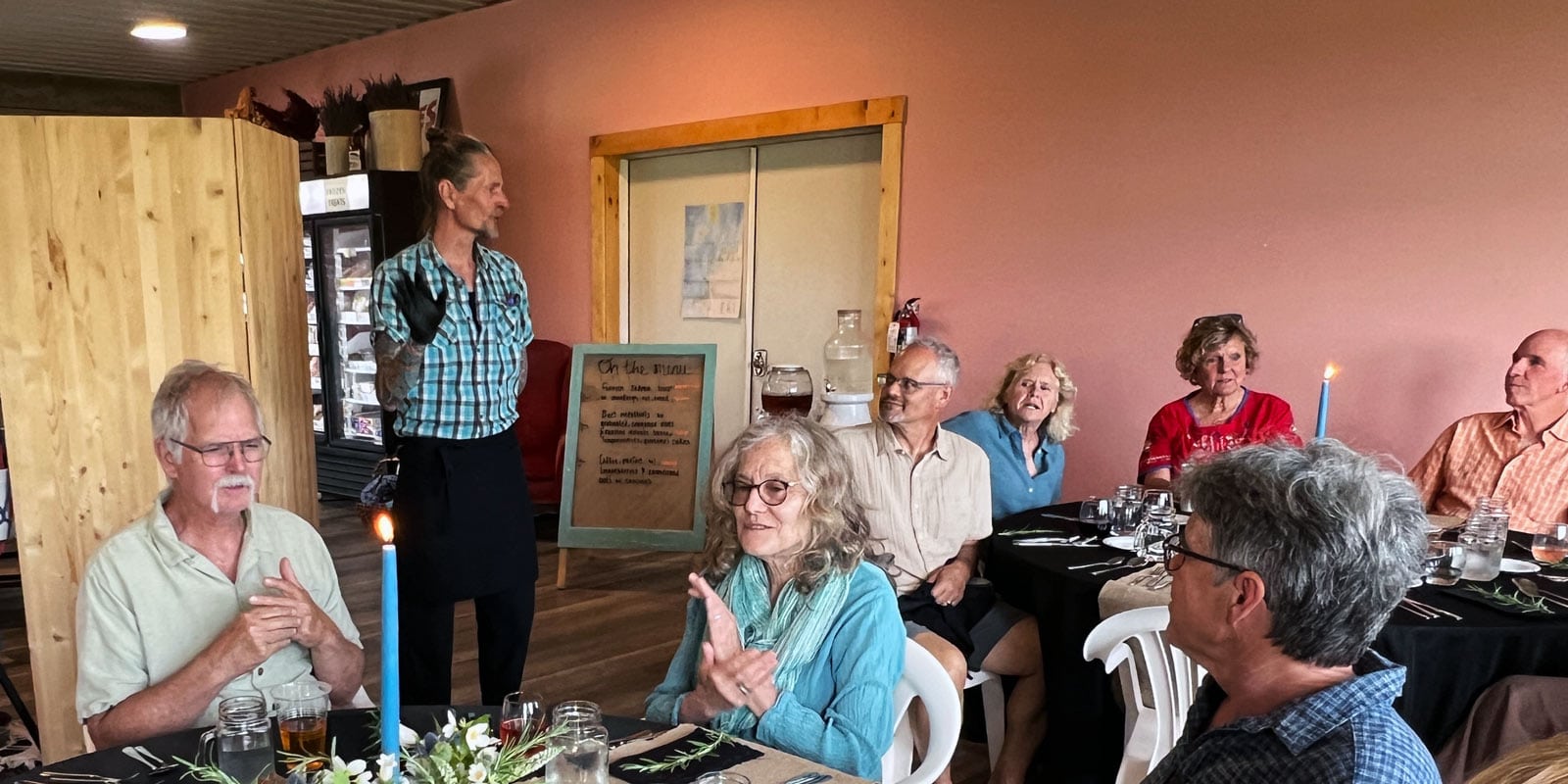 People enjoying farm-to-table dinner