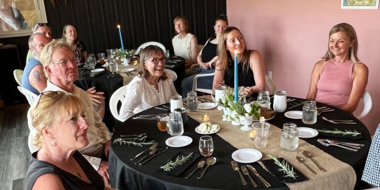 People enjoying farm-to-table dinner